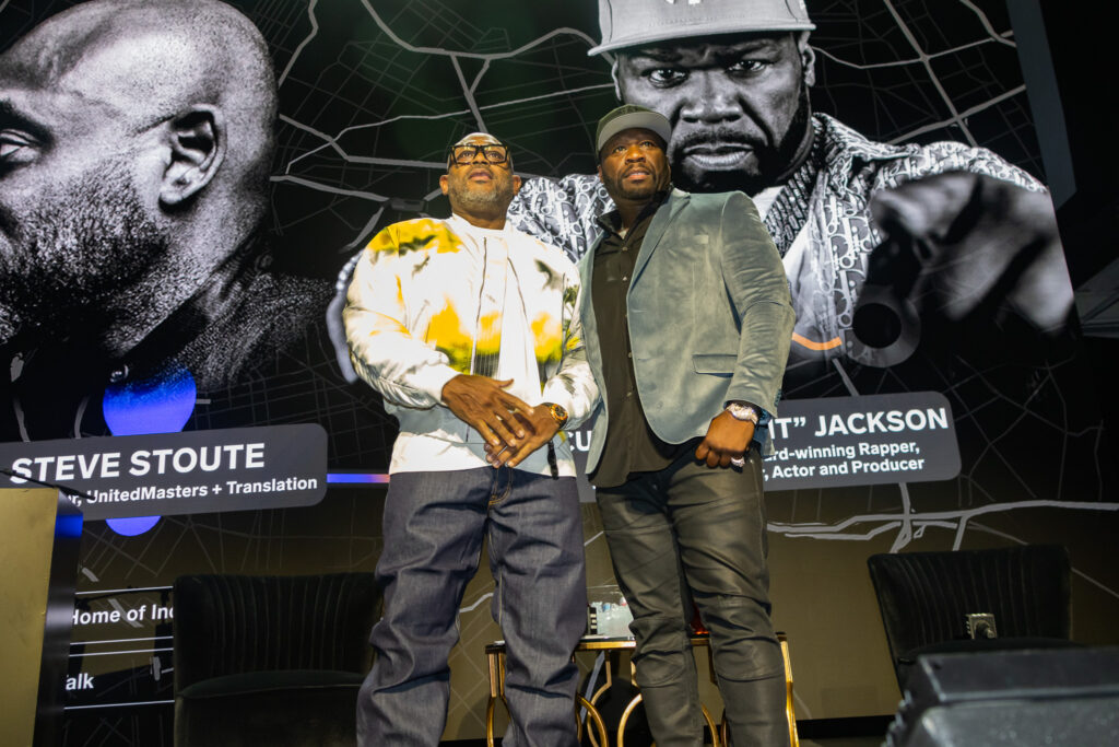 Steve Stoute and 50 Cent standing on stage at 2024 SelectCon NYC
 